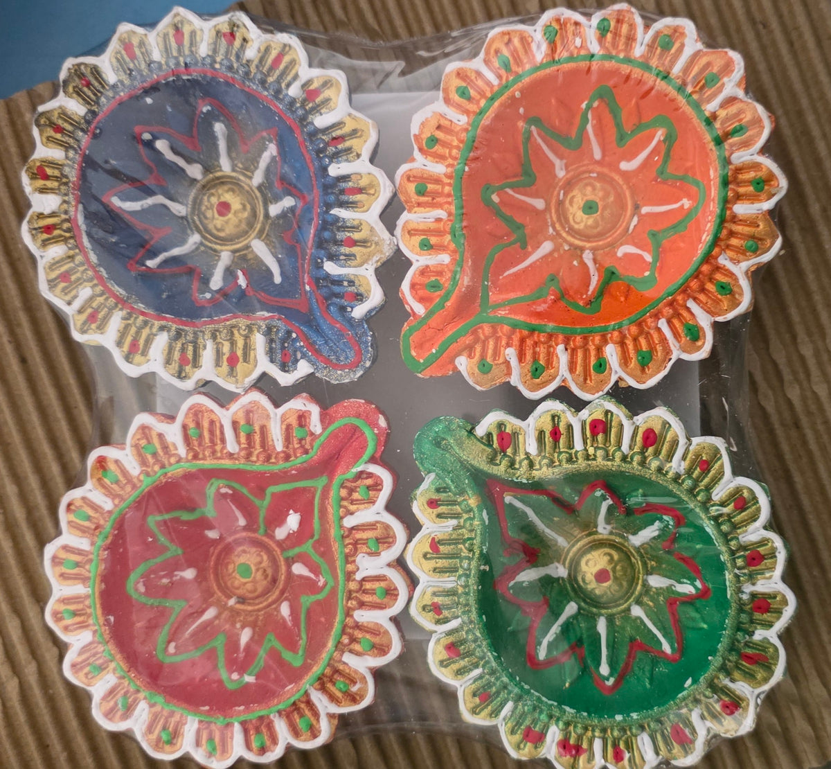Color patterned Clay diyas (set of4 pieces in 4 colors)
